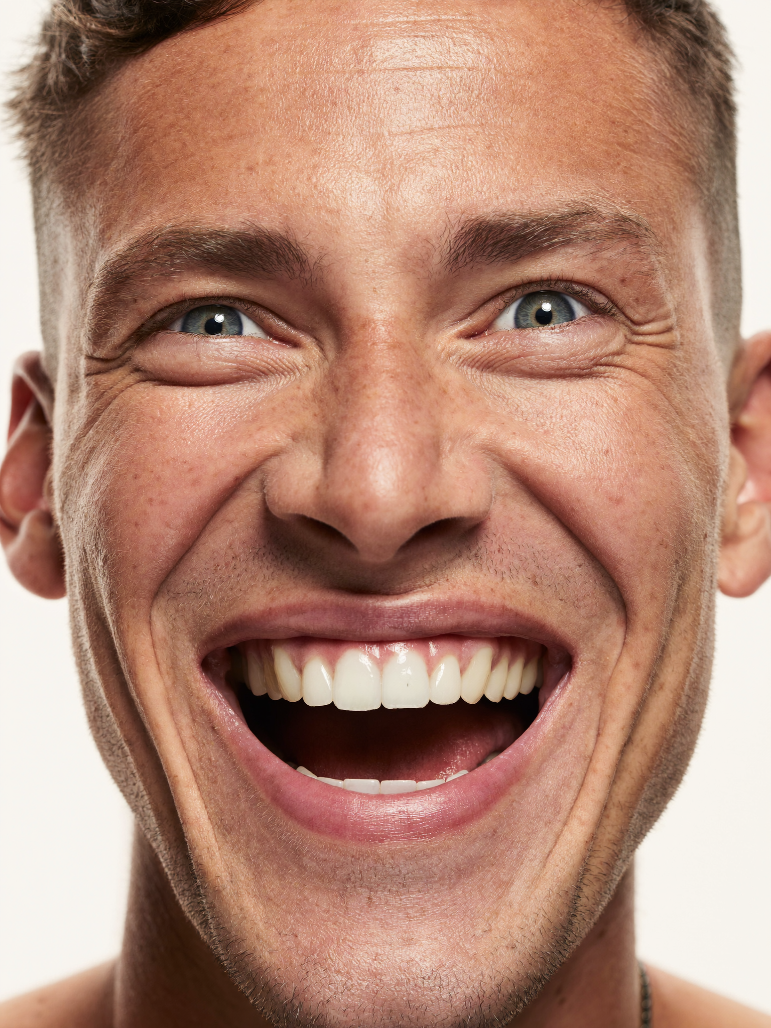 A calm, focused man smiling